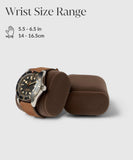 The brown leather watch rests on the Bayswater Watch Box Pillow (55mm X-Small, Brown/Grey) by TAWBURY, with an empty companion cushion. The text "Wrist Size Range 5.5 - 6.5 in, 14 - 16.5 cm" ensures a perfect fit for every wrist beside a hand icon.