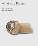 Bayswater Watch Box by TAWBURY features a watch with a brown leather strap on a beige pillow. Text: "Wrist Size Range 5.5 - 6.5 in, 14 - 16.5 cm.