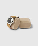 A TAWBURY wristwatch with a black dial and silver casing is displayed on a beige Bayswater Watch Box Pillow - 50mm - X-Small, inside the box with an additional empty pillow.