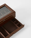 The TAWBURY Bayswater 12 Slot Watch Box with Storage in brown features a glass lid, divided upper compartment for watches, and a pull-out drawer with sections for accessories.