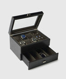 The TAWBURY Bayswater 6 Watch Jewellery Box in black/charcoal features a glass lid and pull-out drawer—ideal for organizing six watches, cufflinks, rings, and sunglasses in style.