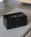 The TAWBURY Bayswater 24 Slot Watch Box with Drawer in Black/Charcoal features PU leather and a glass top, elegantly organizing your watch collection in modern style.