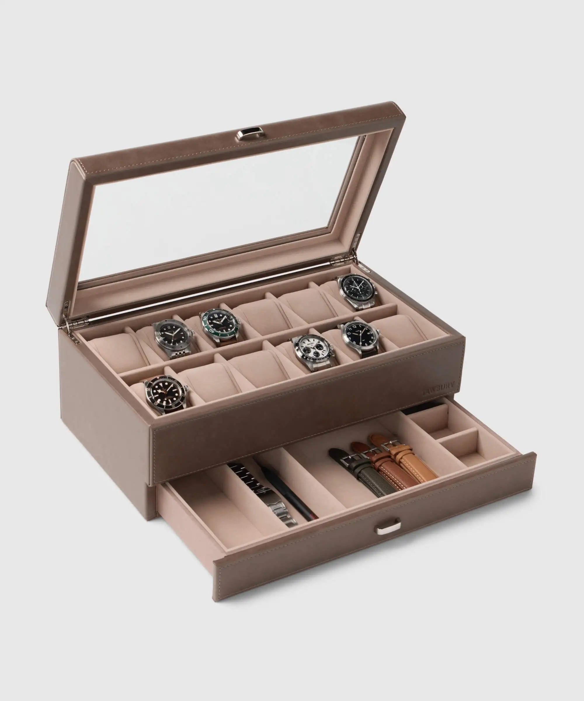 The TAWBURY Bayswater 12 Slot Watch Box with Storage in taupe features a glass lid showcasing twelve watches and a pull-out drawer below for organizing straps and tools.