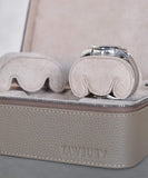 The TAWBURY Fraser Watch Case Pillows - X-Small - Beige features two cushioned compartments with a beige leather exterior and interior. One holds a watch, while the other includes slender wrist pillows for protection. It perfectly combines elegance and practicality among watch travel cases.