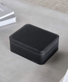 A TAWBURY Fraser 3 Watch Travel Case with Storage - Black serving as a travel storage case for watches.