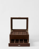 The TAWBURY Bayswater 8 Slot Watch Box with Storage in brown faux leather features a glass lid, compartments for watches, and an open lower drawer with extra sections.
