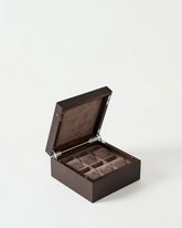 The TAWBURY Grove 6 Slot Wooden Watch Box, crafted from dark walnut wood with a solid lid, is pictured open to reveal six padded compartments against a plain white background.