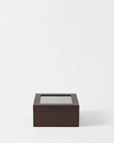 The TAWBURY Grove 6 Slot Wooden Watch Box in dark walnut wood with a glass lid is shown against a plain white background.