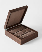 The TAWBURY Grove 12 Slot Wooden Watch Box in Dark Walnut features a solid hinged lid, twelve compartments with soft brown lining and matching cushions—an elegant organizer for watch storage.