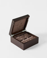 The TAWBURY Grove 6 Slot Wooden Watch Box in dark walnut features a solid hinged lid and opens to reveal six cushioned compartments lined with brown suede-like material.