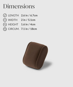 A TAWBURY Fraser 2 Watch Travel Case with Storage - Taupe on a table next to a bottle of perfume.