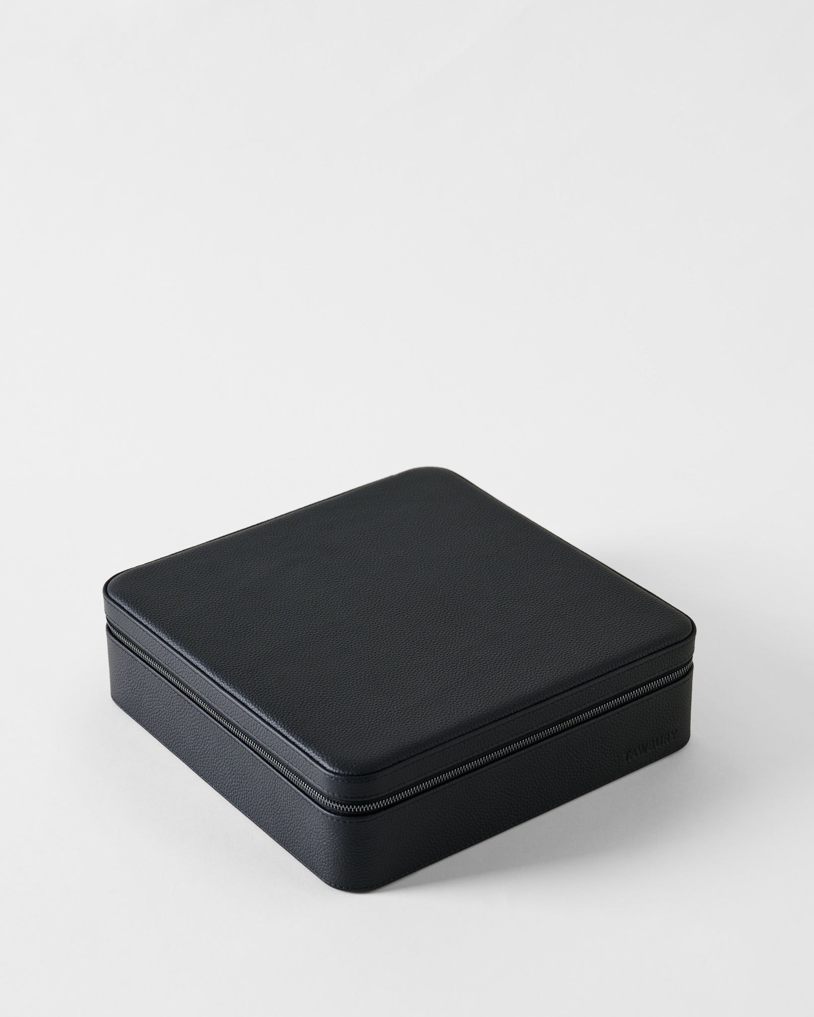 Closed rectangular black leather TAWBURY Fraser 12 Watch Case - Midnight Black with a zippered edge for watch storage.