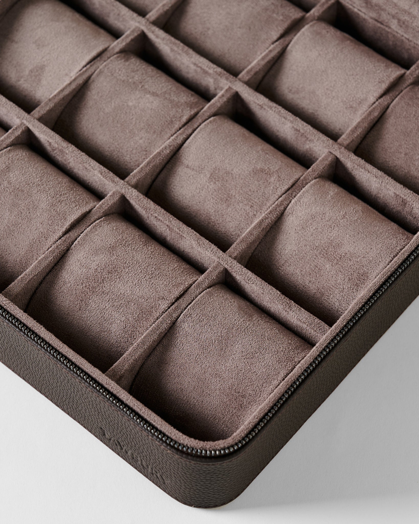 An empty TAWBURY Fraser 12 Watch Case - Espresso Brown with twelve individual compartments and removable cushions.
