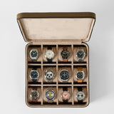 Open TAWBURY Fraser 12 Watch Case - Truffle Taupe leather box with twelve slots, each containing a different analog wristwatch.