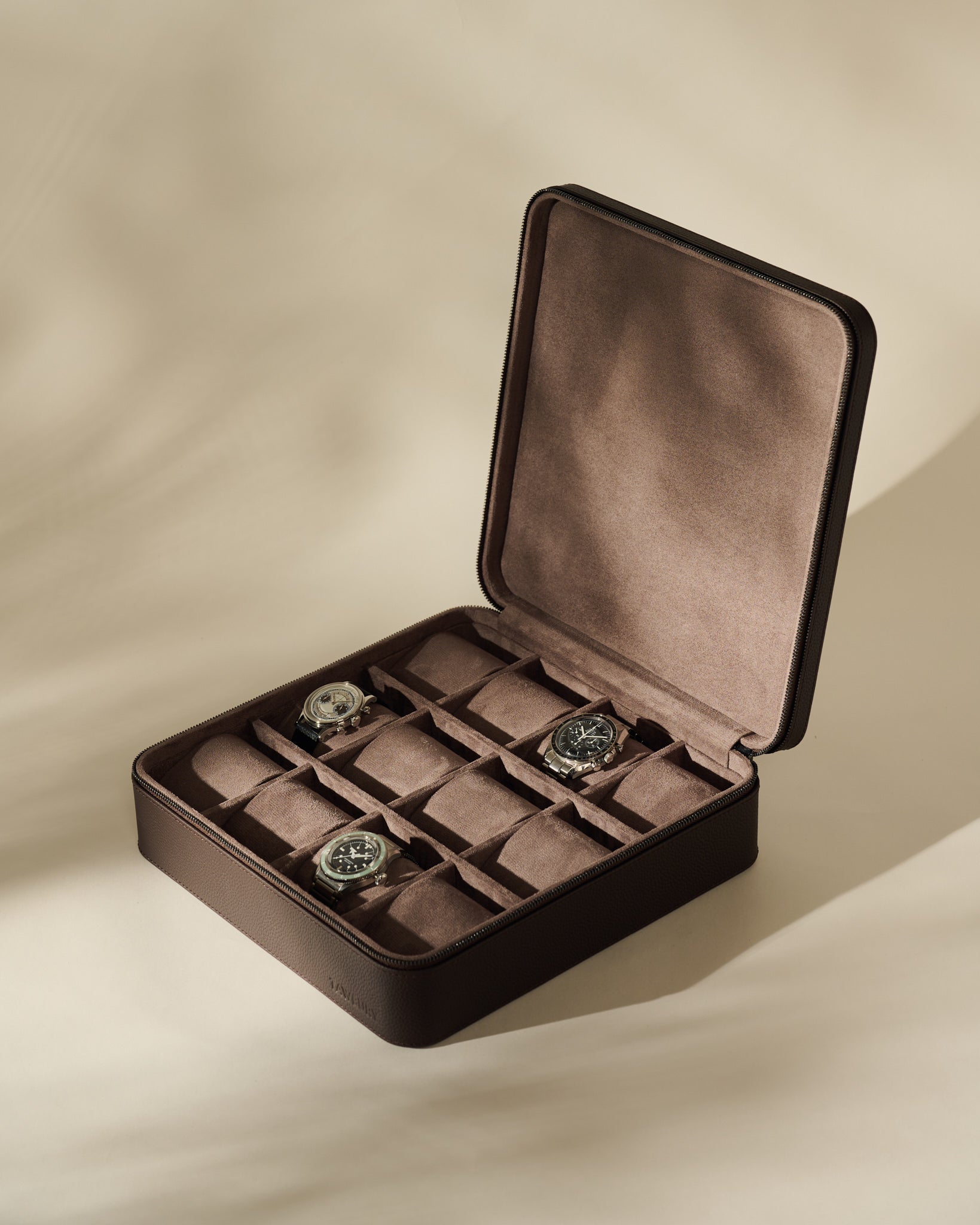 Open TAWBURY Fraser 12 Watch Case - Espresso Brown with twelve storage slots, three of which contain wristwatches.