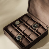 Open TAWBURY Fraser 12 Watch Case - Espresso Brown with twelve compartments, three of which hold wristwatches.