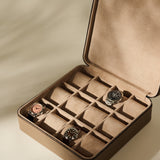 Open Fraser 12 Watch Case - Truffle Taupe with twelve slots, containing three wristwatches.