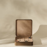 TAWBURY Fraser 12 Watch Case in Truffle Taupe with twelve individual compartments, containing three watches.