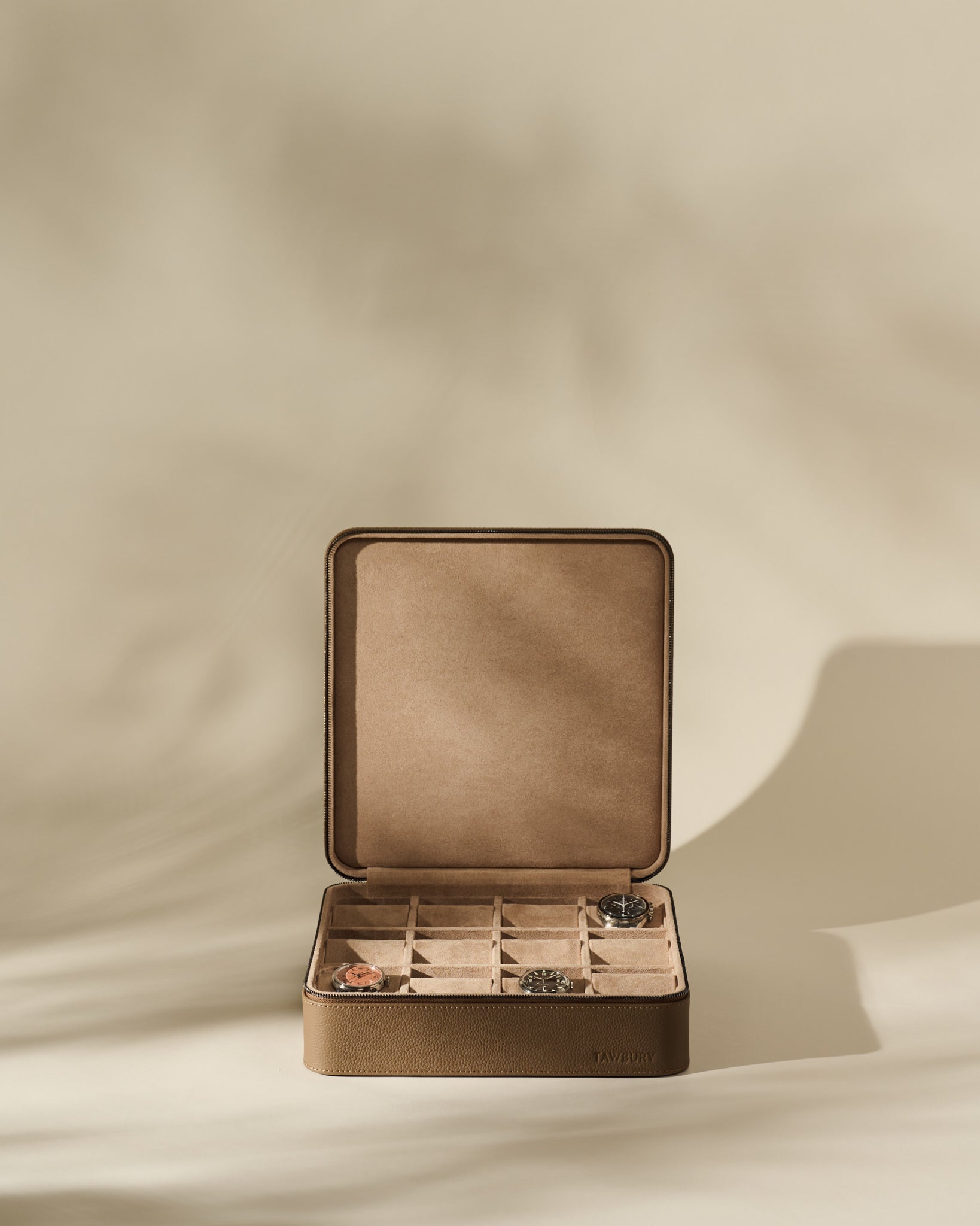 TAWBURY Fraser 12 Watch Case in Truffle Taupe with twelve individual compartments, containing three watches.
