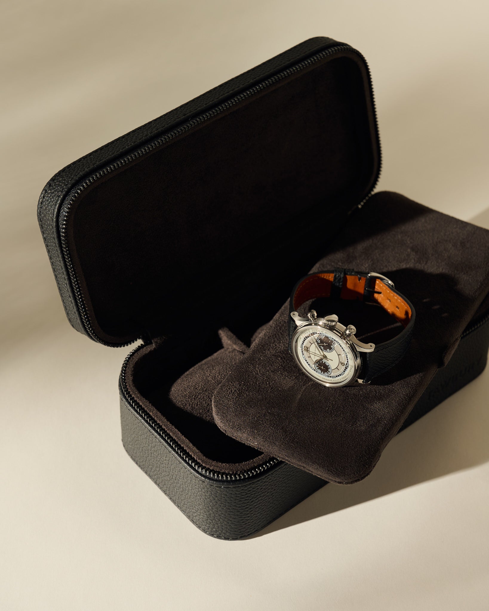 Open Fraser 3 Watch Case - Midnight Black containing a silver chronograph wristwatch with a black leather strap.