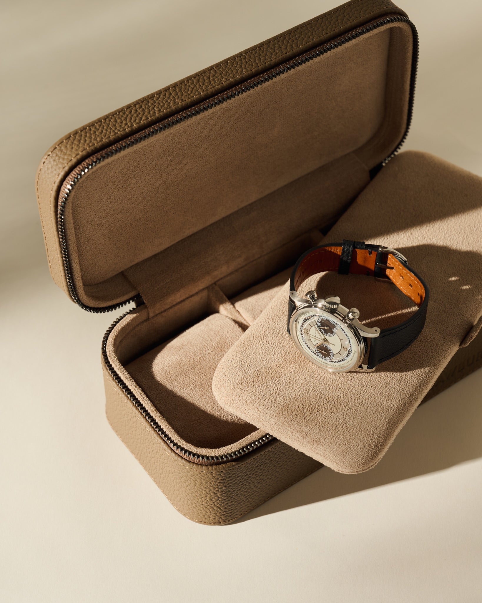 Open Fraser 3 Watch Case - Truffle Taupe with a stainless steel chronograph resting on a padded insert.
