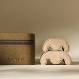 Truffle Taupe TAWBURY Fraser 2 Watch Case with a zipper, next to two stacked beige watch pillows.