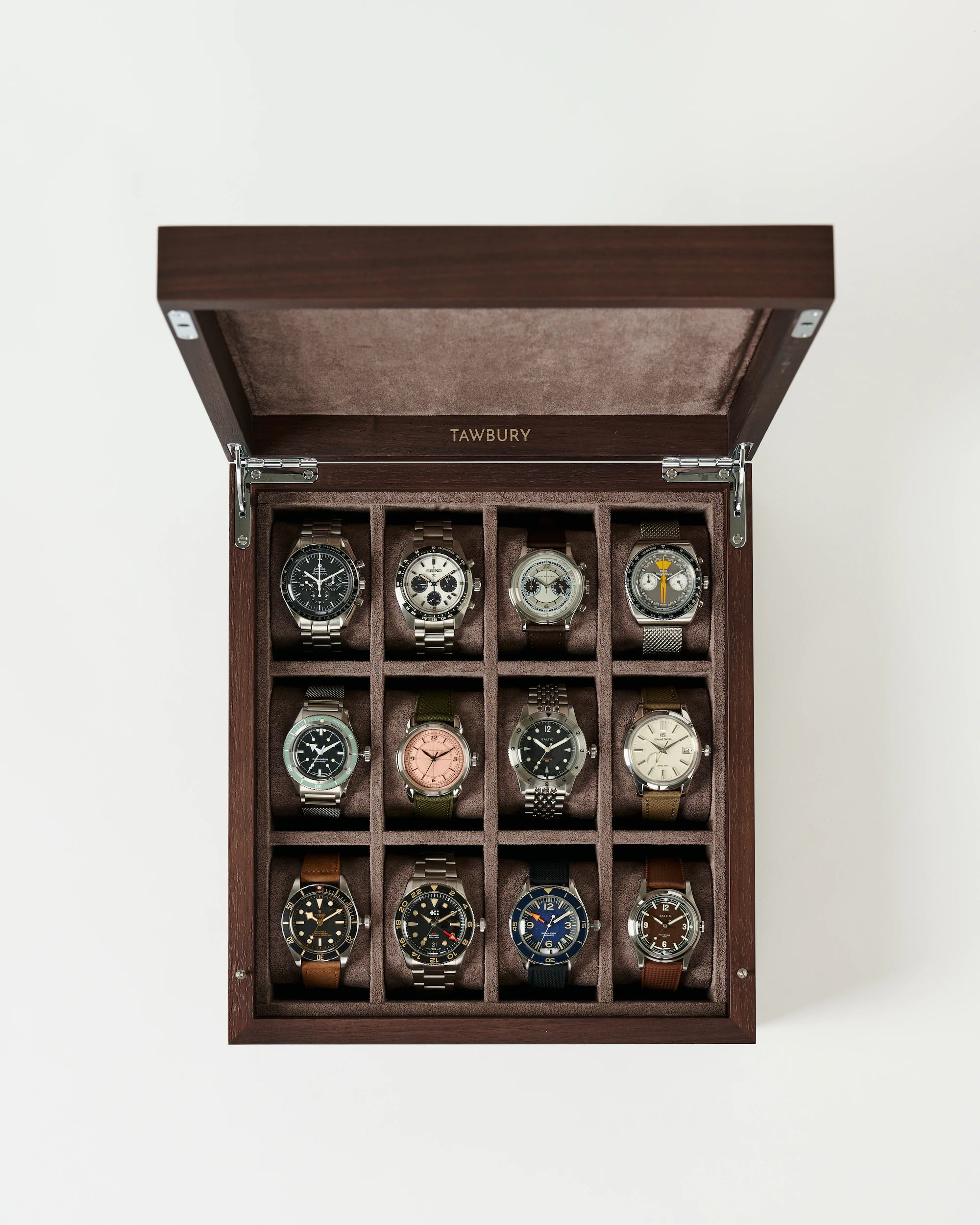 The TAWBURY Grove 12 Slot Wooden Watch Box in dark walnut features a solid lid and velvet interior, providing elegant storage for twelve wristwatches, each in its own compartment arranged in three rows of four.