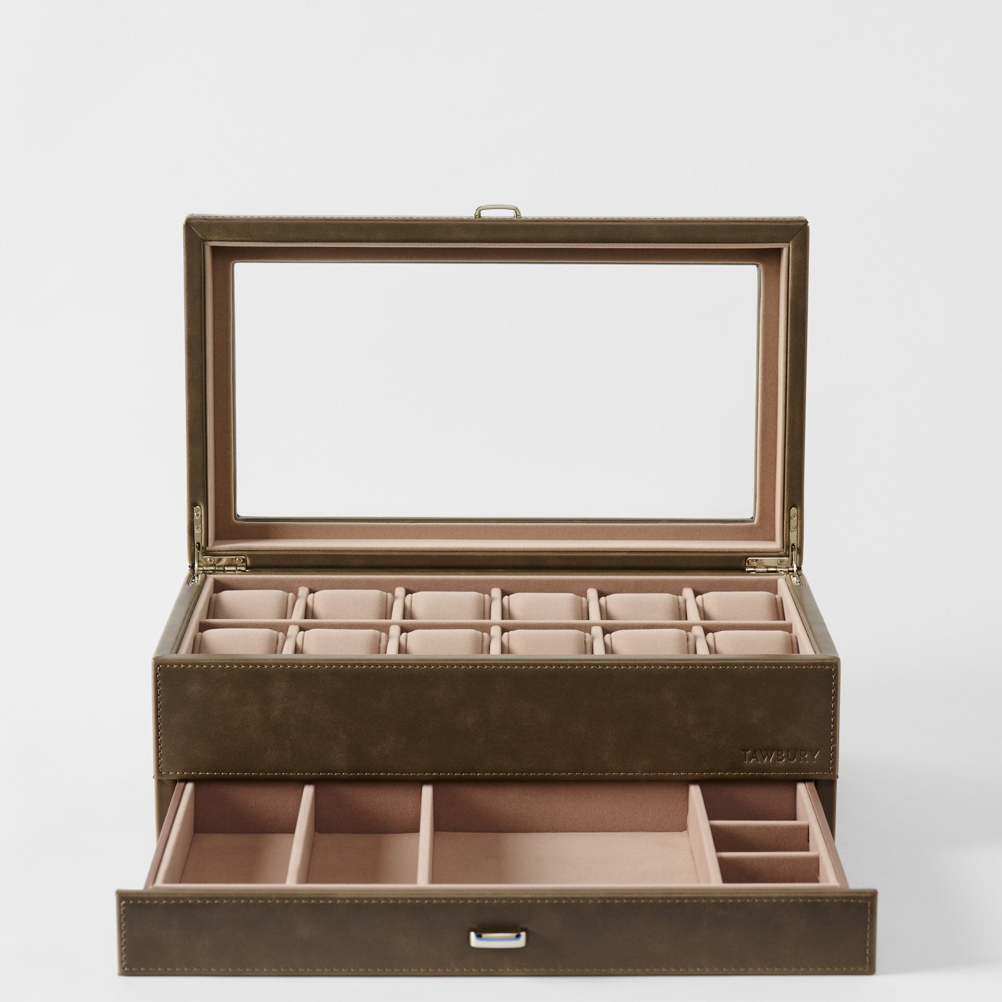 The TAWBURY Bayswater 12 Slot Watch Box with Storage in Driftwood Taupe offers a glass lid, upper watch compartments, and a lower drawer for additional accessories.