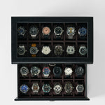 The TAWBURY Bayswater 24 Slot Watch Box with Drawer in Black/Charcoal neatly displays and organizes up to 24 wristwatches, keeping your collection secure and stylishly arranged.