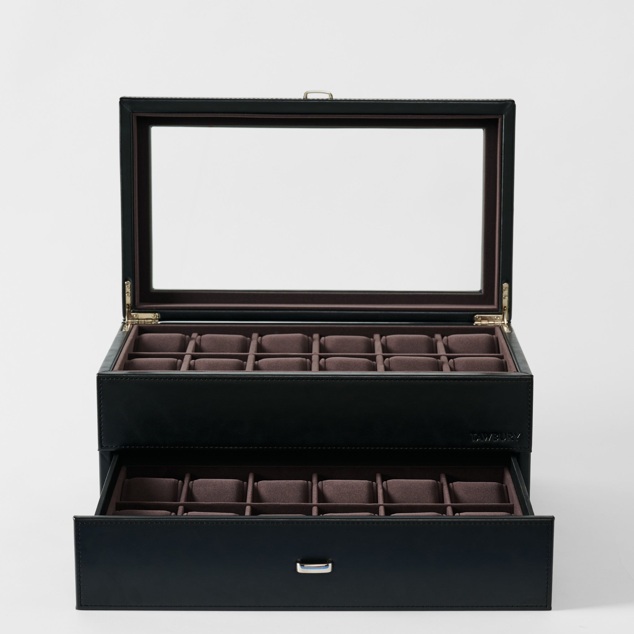 The TAWBURY Bayswater 24 Slot Watch Box with Drawer in Midnight Black features a glass lid, two rows of padded slots for elegant watch display, and a drawer with additional empty slots.