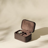 The TAWBURY Fraser 2 Watch Case - Brown is shown open with a single watch inside, set against a neutral beige background and subtle shadows.