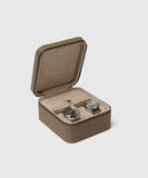 A TAWBURY Fraser 2 Watch Travel Case with Storage - Taupe, containing two watches, perfect for a watch lover in need of secure storage.