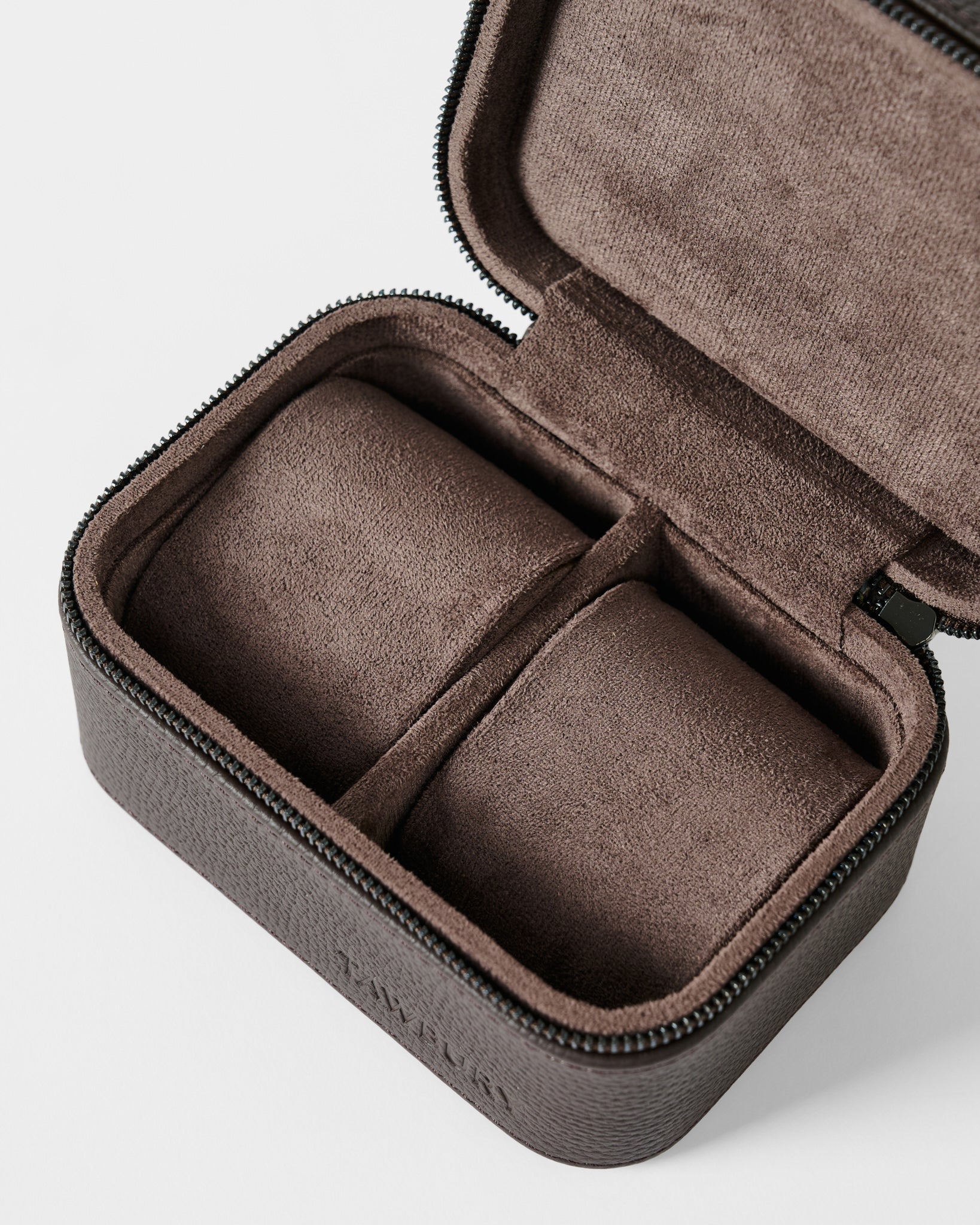The TAWBURY Fraser 2 Watch Case in brown features a zippered leather exterior and soft suede-like interior with two compartments for watches or small accessories.