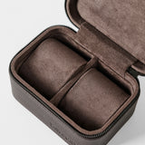 The TAWBURY Fraser 2 Watch Case in brown features a zippered leather exterior and soft suede-like interior with two compartments for watches or small accessories.