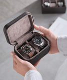 A watch lover showcasing the TAWBURY Fraser 2 Watch Travel Case - Brown during their travel experience.
