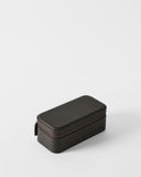 The TAWBURY Fraser 3 Watch Case in brown textured leather with a zipper sits on a plain white surface—ideal for secure travel watch storage.