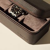 The TAWBURY Fraser 3 Watch Case - Brown features a textured leather exterior and suede interior, ideal for storing your wristwatch with a black bezel and perfect for travel.