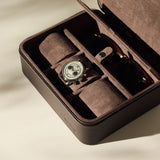 The TAWBURY Fraser 3 Watch Case with Storage - Brown features a suede-lined interior and compartments for your wristwatch and sunglasses. Open on a light surface, it's ideal for organized watch storage on the go.