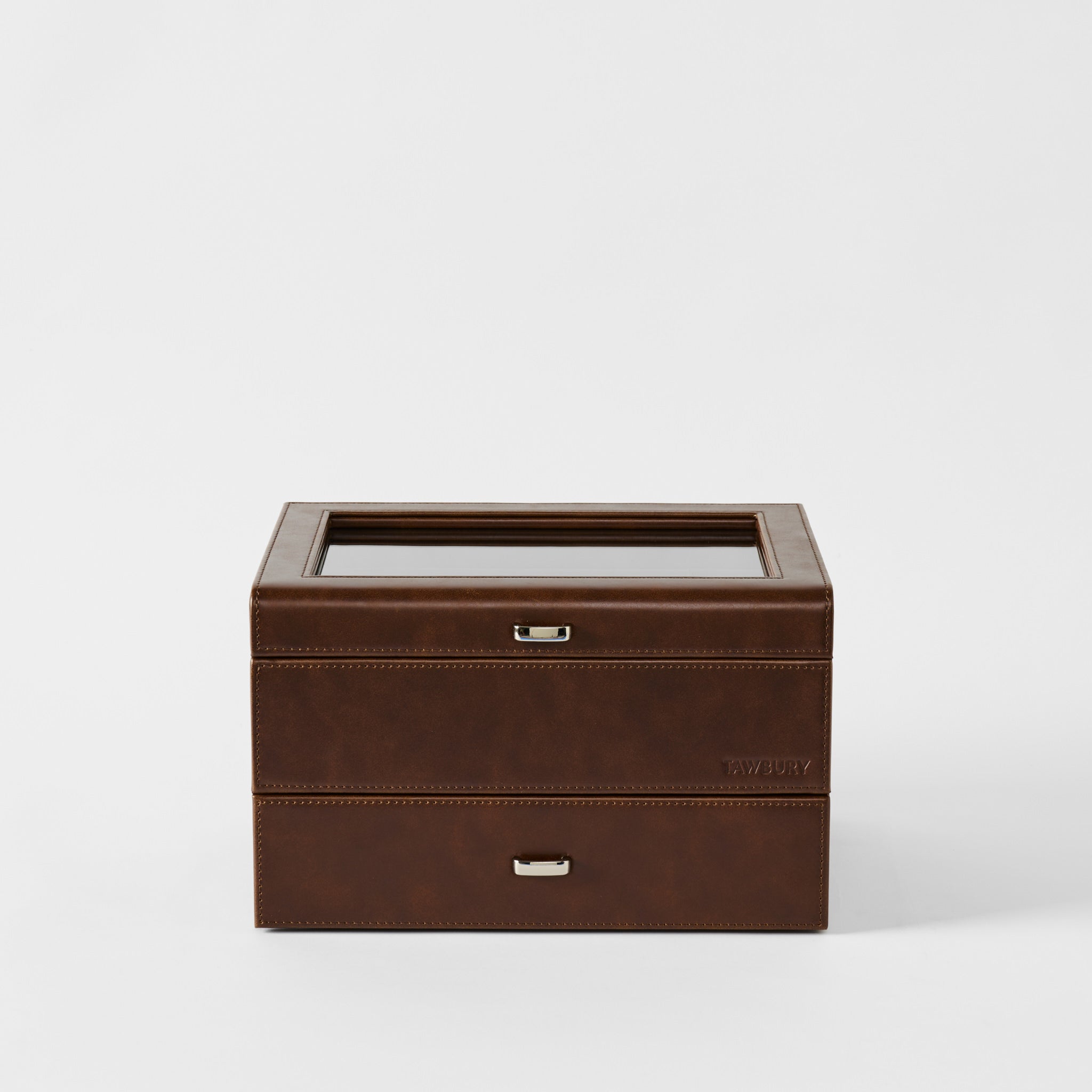 The TAWBURY Bayswater 6 Watch Jewelry Box in chestnut brown faux leather features a glass top and two drawers, elegantly displayed against a plain white background.