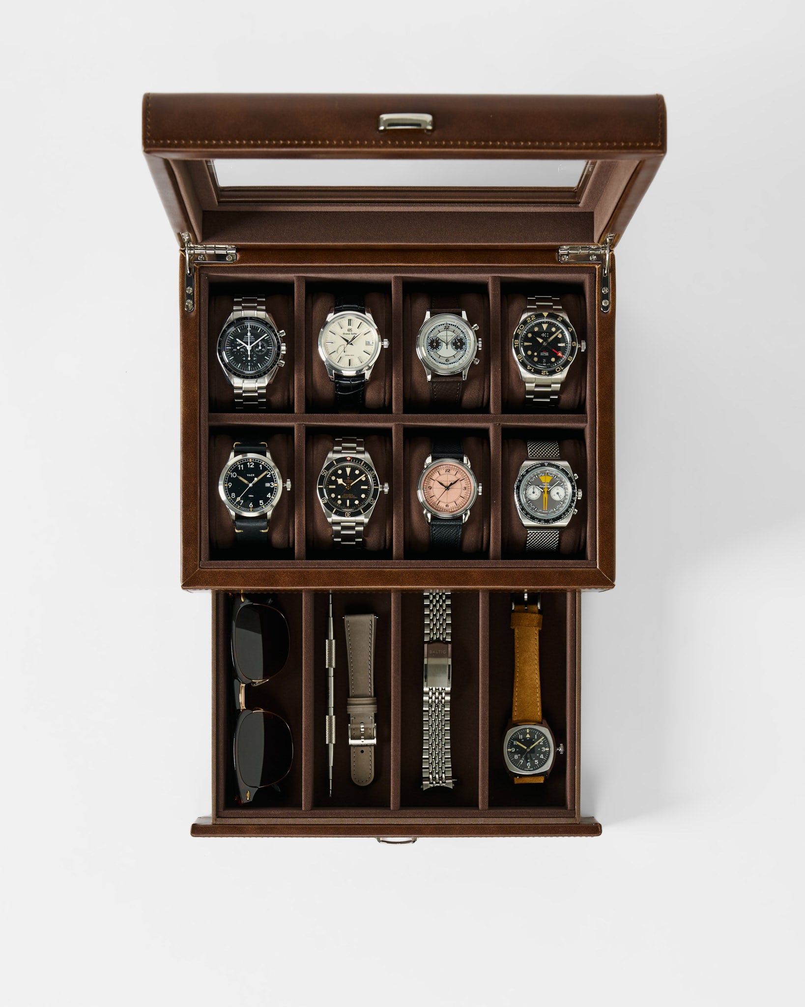The TAWBURY Bayswater 8 Slot Watch Box with Storage in brown faux leather holds eight watches plus extras like sunglasses or straps—stylish, organized storage shown from above.