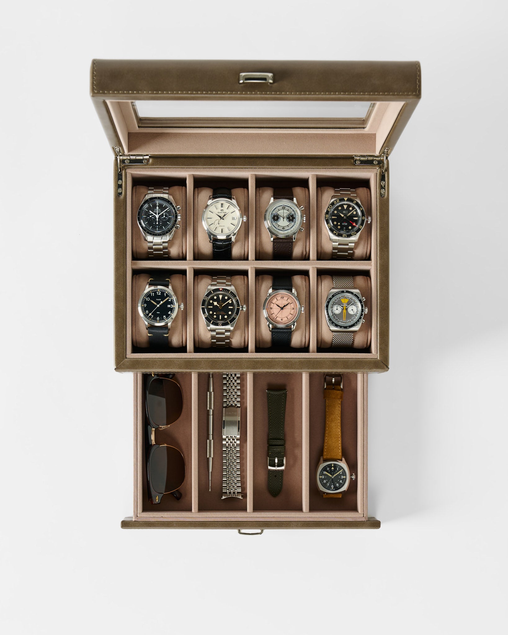 The TAWBURY Bayswater 8 Slot Watch Box with Storage in Taupe elegantly displays eight wristwatches and keeps sunglasses, extra straps, and accessories neatly organized for stylish storage.