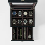 The TAWBURY Bayswater 8 Slot Watch Box with Storage in Black/Charcoal securely holds eight watches, two straps, a pair of sunglasses, and a watch tool in separate compartments for organized premium storage.