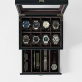 The TAWBURY Bayswater 8 Slot Watch Box with Storage in Black/Charcoal securely holds eight watches, two straps, a pair of sunglasses, and a watch tool in separate compartments for organized premium storage.