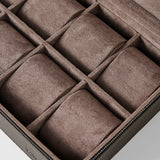 The TAWBURY Fraser 8 Watch Case in brown features a suede-lined interior with multiple padded compartments, perfect for organizing and protecting up to eight watches or other small valuables.