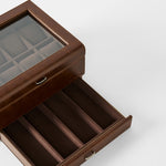 The TAWBURY Bayswater 8 Slot Watch Box with Storage in brown faux leather has a glass lid, upper watch slots, and a lower pull-out drawer for extra storage.