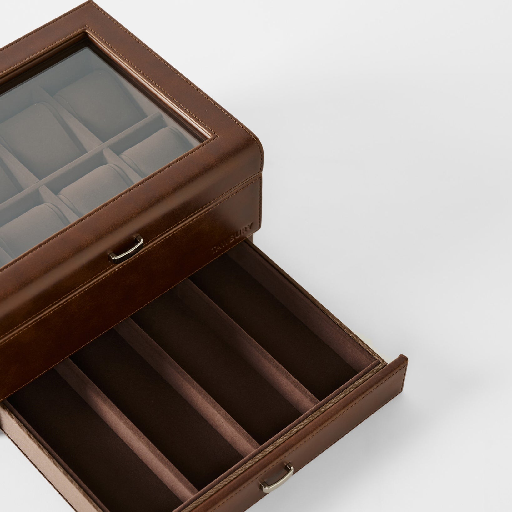The TAWBURY Bayswater 8 Slot Watch Box with Storage in brown faux leather has a glass lid, upper watch slots, and a lower pull-out drawer for extra storage.