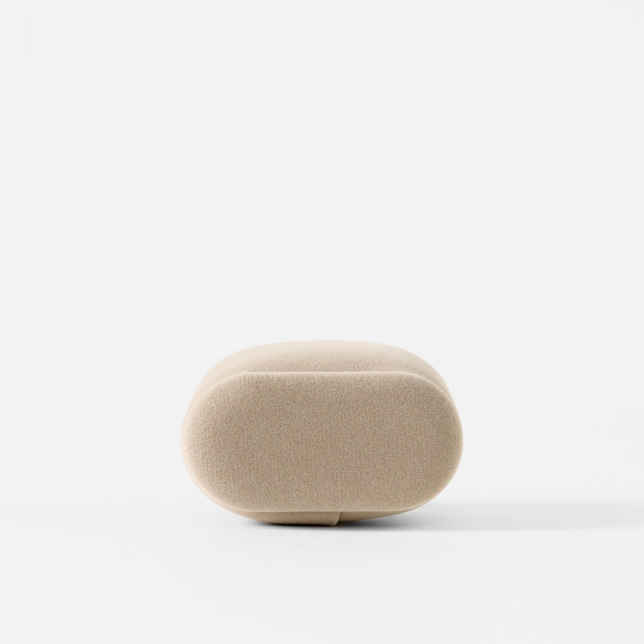 Beige, oval-shaped TAWBURY Bayswater Watch Pillow (55mm, Small), viewed from the front against a plain white background; ideal as a slender cushion for watch storage boxes.