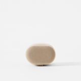 The TAWBURY Bayswater Watch Pillow in beige (X-Small, 55mm) has a soft, smooth texture like velveteen and features an oval shape, shown here on a plain white background.