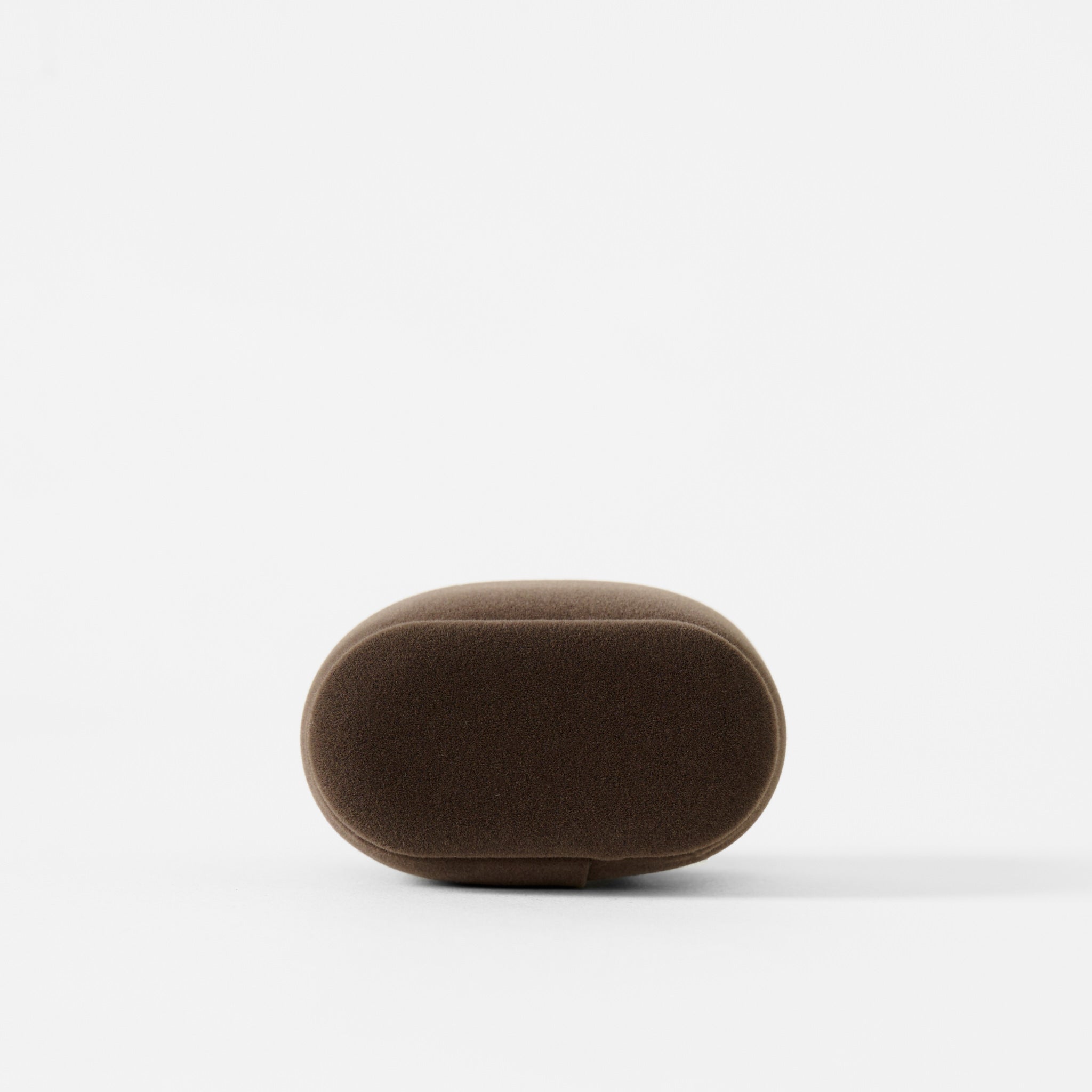 A brown, oval-shaped object with a smooth surface sits on a plain white background, resembling the TAWBURY Bayswater Watch Pillow in Brown/Grey (50mm, Small).