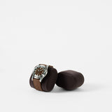 A TAWBURY Bayswater Watch Pillow in charcoal (50mm, X-Small) displays a wristwatch with a brown leather strap, resting beside an identical empty holder on a plain white background.